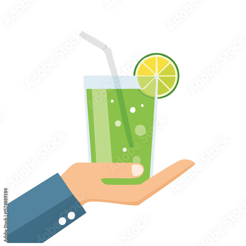 A person's hand holding a glass of green juice with a straw and lime slice