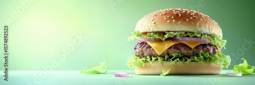 Fresh cheeseburger dreams on a gradient green backdrop, a contemporary food concept