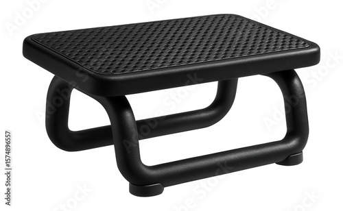 A footrest with a textured rubber surface, ensuring grip and stability in a home gym.