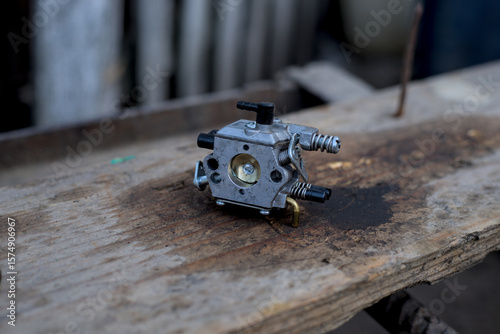 Photo of used carburetor of the chainsaw