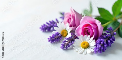 A serene arrangement of lavender, chamomile, and rose blossoms rests on a smooth, white surface; a tranquil scene promoting calmness and well-being , blossoms, wellness, petals