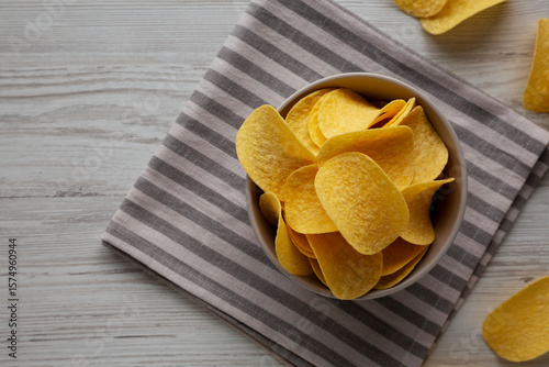 Potato Chips in a Bowl, top view. Flat lay, overhead, from above.