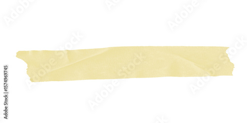 A single horizontal strip of pale yellow masking tape against a solid black background is displayed