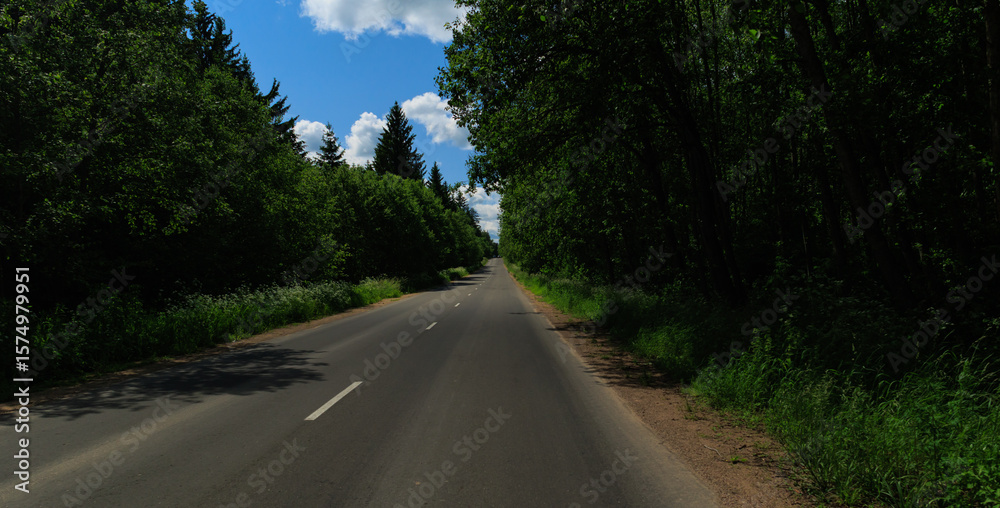 Fototapeta premium Highway wide road, transport and blue sky on a summer day