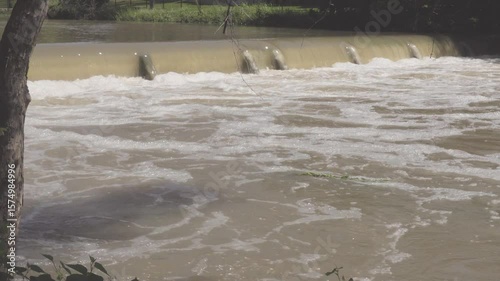 Texas 2025 flood water being released upstream from flood control dam and running over small downstream dam