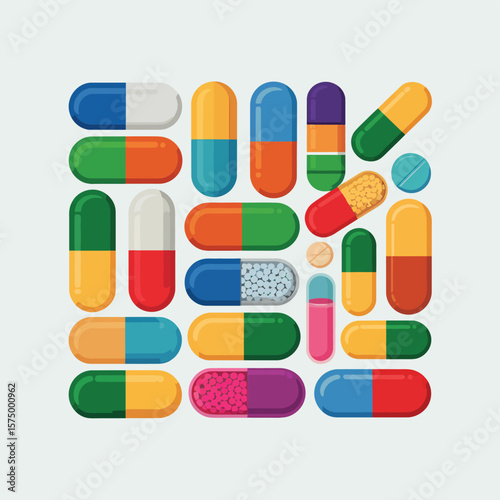 Colorful assortment of medical pills and capsules arranged on a light background