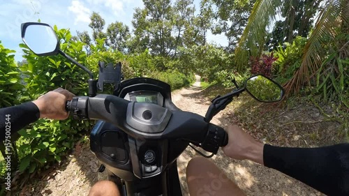 Man Riding Scooter on Dirt Path Through Tropical Forest Captured from First Person Angle with Visible Mirrors and Speedometer, Concept of Adventure Travel and Off-Road Journey