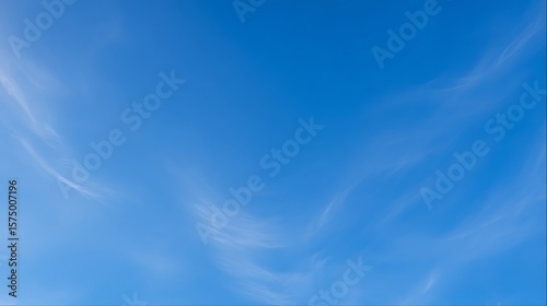Fototapeta Naklejka Na Ścianę i Meble -  Bottom view straight up at vast deep blue sky with thin wispy cirrus clouds
