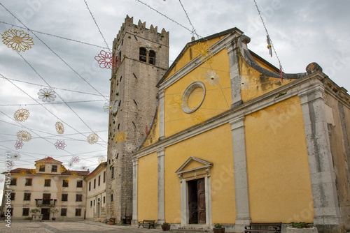 Motovun church and bell tower with festive decorations, Croatia