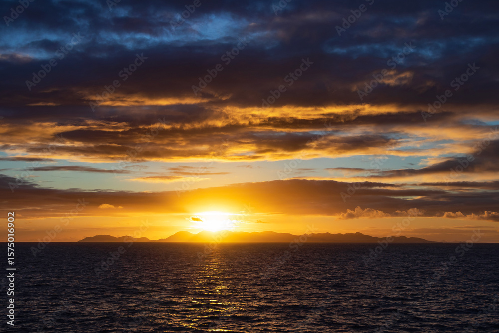 Sunrise over the island of Saint Martin in the Leeward Islands of the Lesser Antilles in the northeastern Caribbean. Sunrise over the island of Saint Martin in the Leeward Islands of the Lesser Antilles in the northeastern Caribbean.
