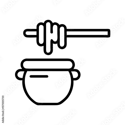 Honey pot with wooden dipper and honey dripping from it  
