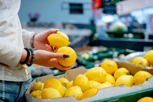 Wallpaper Mural Girl Choosing Lemons At Supermarket Torontodigital.ca