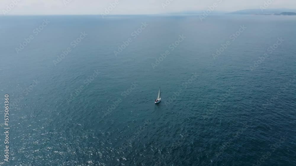 Aerial view of sailboat on tranquil Mediterranean Sea, Mediterranean. Aerial view of sailboat on tranquil Mediterranean Sea, Mediterranean.