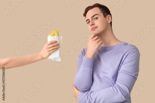 Thoughtful young man and ha...