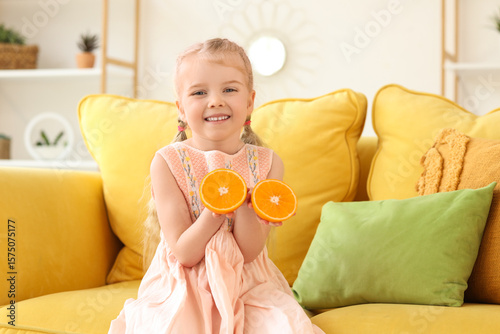 Cute little girl with orang...