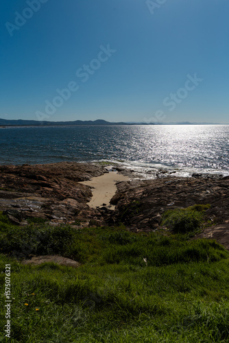 Fototapeta Naklejka Na Ścianę i Meble -  Ocean view with rocky coastline on a sunny day.