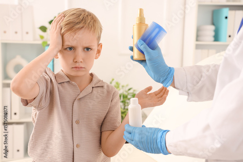 Upset little boy receiving ...