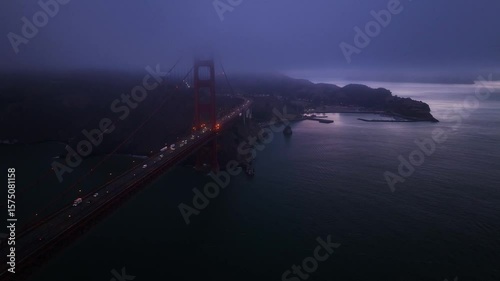Aerial view of foggy golden gate bridge at night, United States.