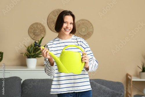 Smiling young woman with wa...