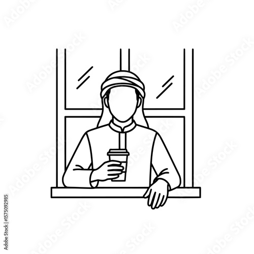 Man holding coffee cup by window