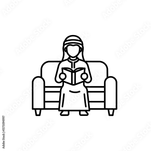 Person reading a book while sitting on a couch at home
