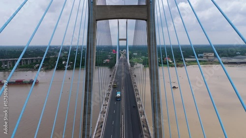 Drone shot of Hanoi iconic Nhat Tan Bridge, blending bold architectural lines with flow of the River