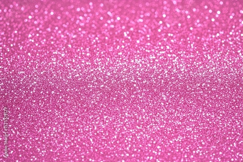 Close-up of sparkling pink glitter texture creating a shiny and festive atmosphere with shimmering light reflections
