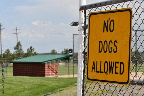 No dogs allowed sign at baseball diamond