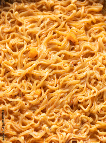Top view of instant noodles in spicy soup for background