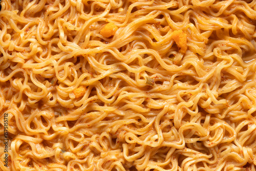 Top view of instant noodles in spicy soup for background