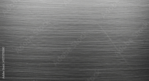 Macro shot of brushed metal surface texture with fine parallel lines and cool gray tones