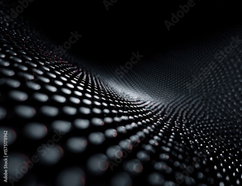 Abstract dark gray surface with a swirling pattern of small dots and red highlights