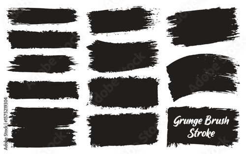 Collection of black grunge brush strokes and paint splatters on a white background