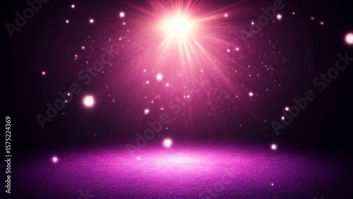 Glowing pink spotlight casting radiant sparkles and soft light beams over illuminated dark floor. Abstract and lighting concept