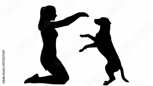 Silhouette of woman kneeling and training a dog to stand on its hind legs against white background | editable eps vectors
