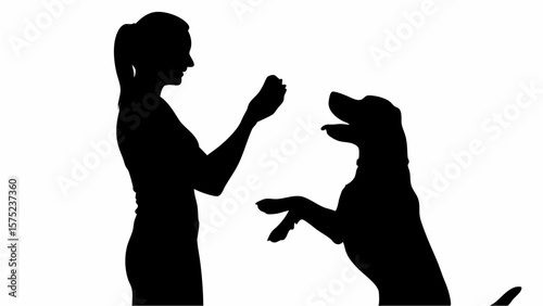 Silhouette of a woman training a dog to sit up and beg with a treat in her hand on a white background | editable eps vectors