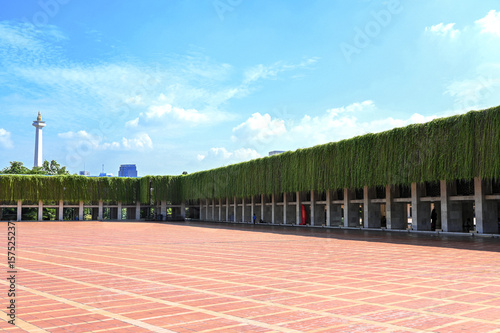 a view of the national monument (monas) from the second floor of the istiqlal mosque