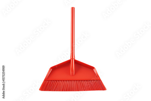 A bright red plastic push broom isolated on black.