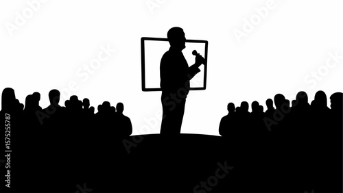 Silhouette of a speaker with microphone presenting to an audience in front of a screen display area