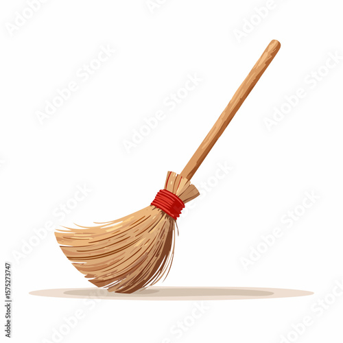 A simple, rustic broom with a long wooden handle and straw bristles, tied with red twine, rests on a white background.