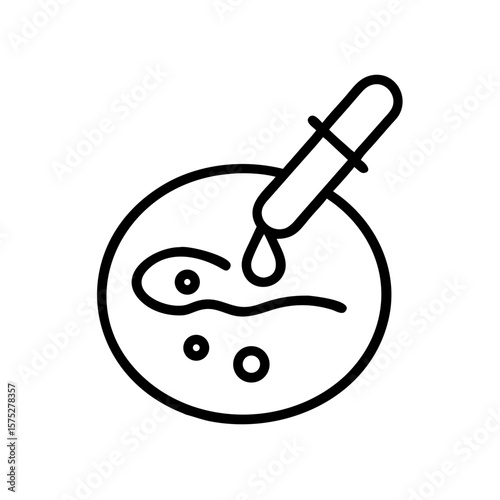 Petri dish with sample being treated with dropper for analysis  