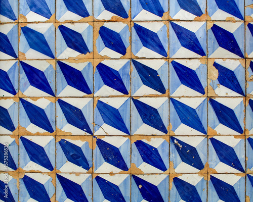 Colonial tiles, decorated with geometric patterns, blue and white on the facade of a colonial residence in the city of Viana, MA, Brazil.