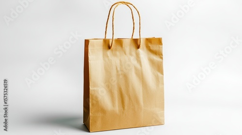 Empty kraft paper shopping bag on a white background.