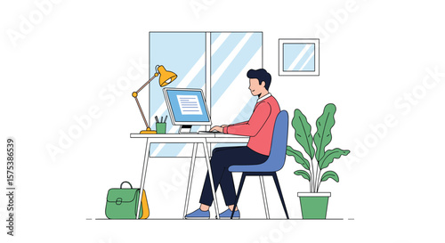 Young man working diligently on his computer at a modern desk