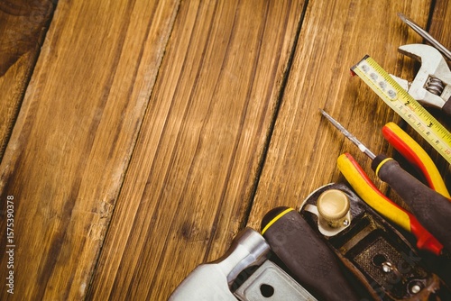 Vector flat lay is showing wrench tape and screwdrivers on wood grain copy space