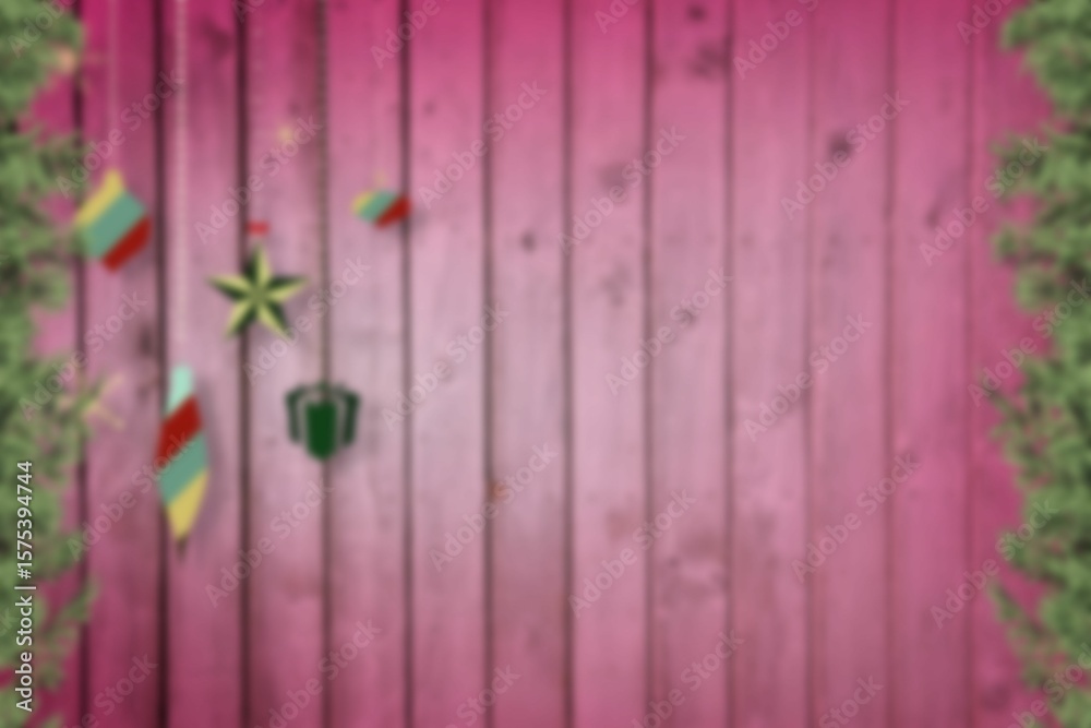 Obraz premium Blurred christmas decorations hanging over wood