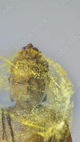 Swirling golden particles and blue light surrounding Buddha statue in animation