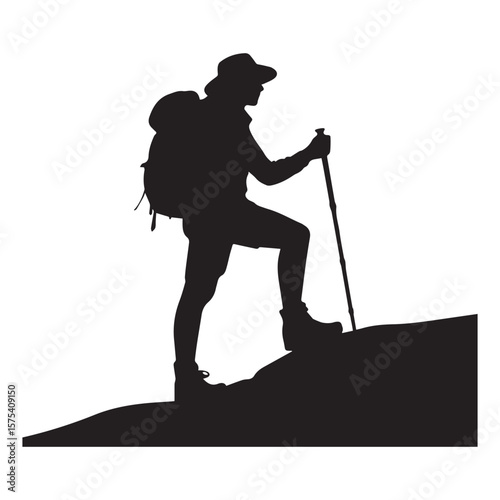 Silhouette of a hiker with a backpack and trekking pole climbing a hill