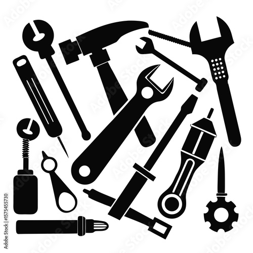 Assorted black mechanical tools arranged on a white background wrench hammer