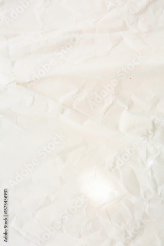 old crumbled paper with lights and shadows, texture background